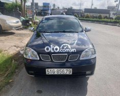 Daewoo Lacetti 2005 - Bán ô tô Daewoo Lacetti sản xuất 2005, màu đen còn mới, 110 triệu giá 110 triệu tại Tiền Giang