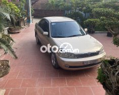 Ford Laser    2002 - Cần bán gấp Ford Laser 2002, màu vàng giá 115 triệu tại Vĩnh Phúc