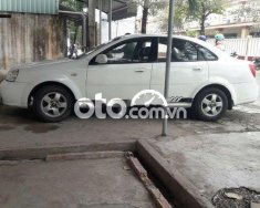 Daewoo Lacetti   EX  2005 - Cần bán Daewoo Lacetti EX đời 2005, màu trắng, xe nhập giá 115 triệu tại Tiền Giang