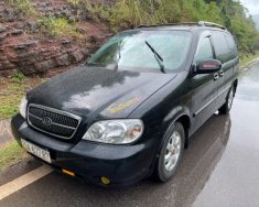 Kia Carnival   GS 2.5 AT  2009 - Cần bán Kia Carnival GS 2.5 AT năm sản xuất 2009, màu đen, 215 triệu giá 215 triệu tại Vĩnh Phúc