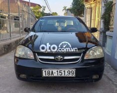 Daewoo Lacetti MT 2005 - Cần bán xe Daewoo Lacetti MT sản xuất 2005, màu đen giá 95 triệu tại Gia Lai