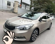 Kia K3   AT 2014 - Bán xe Kia K3 AT năm 2014, màu vàng cát, nhập khẩu giá 390 triệu tại Hà Nội