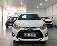 Toyota Wigo 2019 - Cần bán lại xe Toyota Wigo 1.2MT sản xuất 2019, màu trắng, xe nhập, thủ tục hồ sơ rõ ràng nhanh gọn giá 305 triệu tại Bình Phước