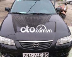 Mazda 626 MT 2001 - Cần bán lại xe Mazda 626 MT sản xuất năm 2001, màu đen giá 120 triệu tại Hà Nội