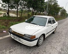 Mazda 323 1994 - Xe Mazda 323 2.0MT sản xuất năm 1994, màu trắng, xe nhập giá 25 triệu tại Hà Nội