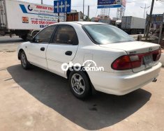 Mazda 323 MT 2000 - Bán Mazda 323 MT sản xuất 2000, màu trắng giá 75 triệu tại Tiền Giang