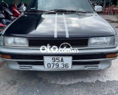 Toyota Corolla     1998 - Cần bán gấp Toyota Corolla sản xuất 1998, màu đen, xe nhập, giá tốt giá 59 triệu tại Hậu Giang