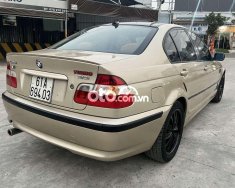 BMW 318i 2002 - Bán xe BMW 318i sản xuất năm 2002, màu vàng giá 150 triệu tại Tp.HCM