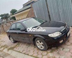 Mazda 323 Bán xe   màu đen, sx 2002. 2002 - Bán xe Mazda 323 màu đen, sx 2002. giá 93 triệu tại Hải Dương