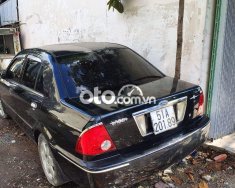 Ford Laser   1.8 2003 đen bóng xe zin 2023 - Ford Laser 1.8 2003 đen bóng xe zin giá 90 triệu tại Tp.HCM