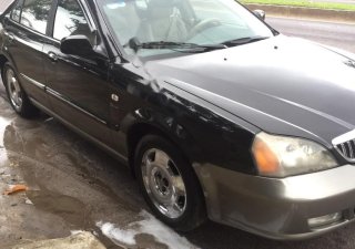 Daewoo Magnus 2.5 AT 2004 - Cần bán Daewoo Magnus 2.5 AT đời 2004, màu đen xe gia đình, giá tốt