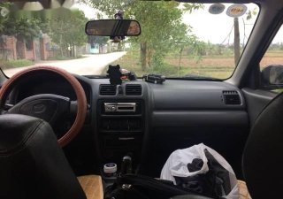 Mazda 323 MT 2000 - Bán Mazda 323 MT đời 2000, màu đen, xe nhập số sàn, 115 triệu
