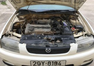 Mazda 323 MT 2000 - Bán xe Mazda 323 MT năm sản xuất 2000, màu trắng