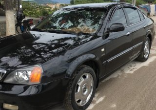 Daewoo Magnus 2.5 AT 2004 - Cần bán xe Daewoo Magnus 2.5 AT đời 2004, màu đen