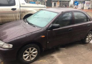 Mazda 323 2000 - Bán xe Mazda 323 đời 2000, xe nhập khẩu, màu nâu tím, máy còn nguyên bản