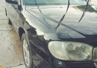 Kia Spectra 2005 - Cần bán xe Kia Spectra năm 2005, màu đen