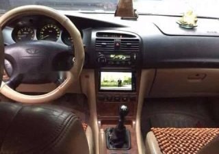 Daewoo Magnus   2002 - Cần bán lại xe Daewoo Magnus năm sản xuất 2002, màu vàng ít sử dụng