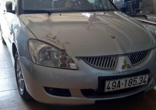 Mitsubishi Lancer 2004 - Cần bán xe cũ Mitsubishi Lancer năm sản xuất 2004, màu bạc xe gia đình