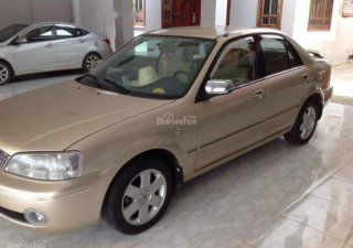 Ford Laser  MT 2004 - Chính chủ bán xe Ford Laser MT sản xuất 2004, màu vàng, nhập khẩu