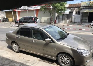 Mitsubishi Lancer   2005 - Bán xe Mitsubishi Lancer 2005, màu vàng còn mới, giá tốt