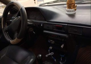 Mazda 323   1995 - Cần bán gấp Mazda 323 đời 1995, màu trắng, đèn trước sau mới thay, về chỉ việc đi