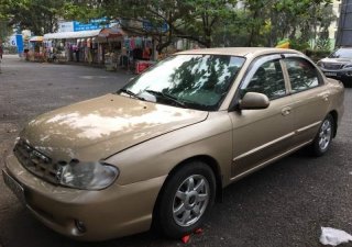 Kia Spectra 2004 - Cần bán Kia Spectra sản xuất năm 2004, màu vàng còn mới