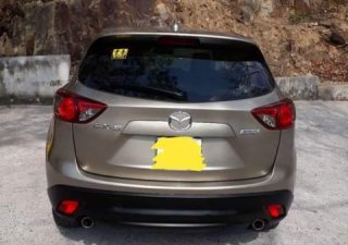 Mazda CX 5 AT 2WD  2014 - Cần bán lại xe Mazda CX 5 AT 2WD năm 2014, màu ghi vàng 