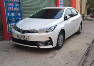 Toyota Corolla altis 1.8E 2017 - Bán xe Toyota Corolla altis 1.8E sản xuất 2017, màu trắng chính chủ, 690 triệu