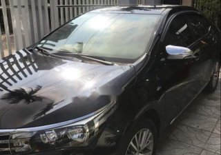 Toyota Corolla altis  MT 2017 - Cần bán gấp Toyota Corolla Altis MT đời 2017, màu đen, xe gia đình sử dụng kĩ nên còn rất đẹp