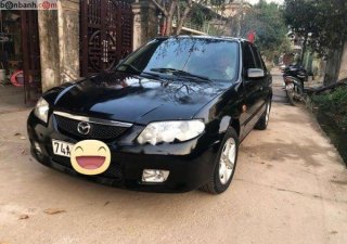 Mazda 323 2002 - Bán Mazda 323 đời 2002, màu đen, nhập khẩu  