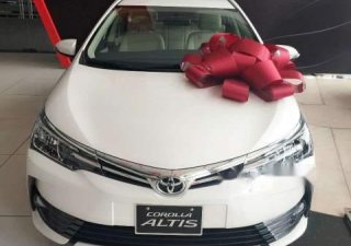 Toyota Corolla altis  1.8E  2019 - Cần bán xe Toyota Corolla Altis 1.8E 2019, màu trắng, 733 triệu