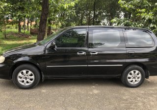 Kia Carnival GS 2006 - Bán xe Kia Carnival GS năm 2006, màu đen, xe gia đình chính chủ sử dụng, dòng xe hạng sang cao cấp