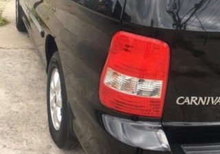 Kia Carnival GS 2006 - Bán xe Kia Carnival GS năm 2006, màu đen, xe gia đình chính chủ sử dụng, dòng xe hạng sang cao cấp