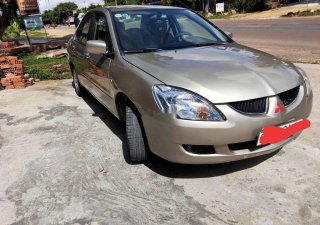 Mitsubishi Lancer 2004 - Bán Mitsubishi Lancer đời 2004, màu vàng, xe nhập xe gia đình