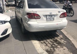 Toyota Corolla 2005 - Bán Toyota Corolla sản xuất 2005, màu trắng, xe đẹp hoàn hảo