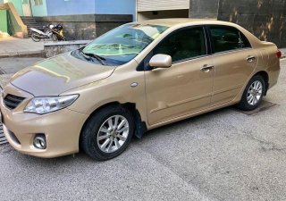 Toyota Corolla 2011 - Bán xe Toyota Corolla sản xuất 2011, màu vàng, xe nhập