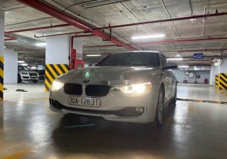 BMW 3 Series   2014 - Cần bán lại xe BMW 320i sản xuất 2014, màu trắng, xe nhập, giá 750tr