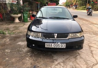 Mitsubishi Lancer GLXI 1.6 MT 2003 - Cần bán Mitsubishi Lancer GLXI 1.6 MT sản xuất 2003, màu xanh lam xe gia đình