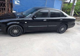 Daewoo Magnus 2007 - Bán xe Daewoo Magnus đời 2007, màu đen, 165 triệu