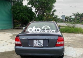 Mazda 323    2001 - Cần bán xe Mazda 323 đời 2001, màu xám, xe nhập còn mới