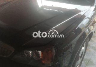 Daewoo Magnus 2004 - Cần bán xe Daewoo Magnus đời 2004, màu đen, nhập khẩu, 85 triệu