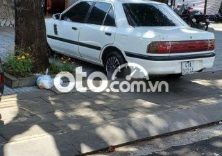 Mazda 323 1995 - Bán Mazda 323 đời 1995, màu trắng, nhập khẩu nguyên chiếc, giá 70tr