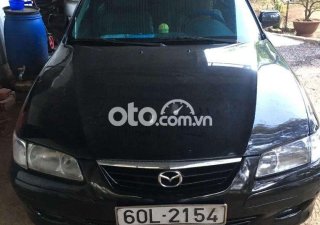 Mazda 626    2001 - Xe Mazda 626 2001, màu đen, xe nhập còn mới, giá 95tr