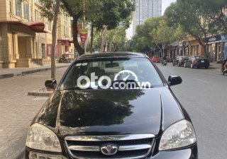 Daewoo Lacetti   EX 2010 - Cần bán Daewoo Lacetti EX sản xuất năm 2010, màu đen số sàn, giá 150tr