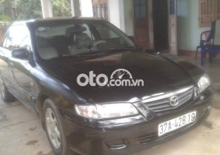 Mazda 626 2002 - Bán Mazda 626 năm sản xuất 2002, màu đen, xe nhập