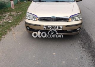 Ford Laser    MT 2002 - Bán Ford Laser MT năm 2002, màu vàng