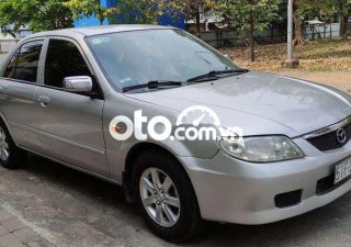 Mazda 323  MT 2002 - Cần bán xe Mazda 323 MT sản xuất 2002, màu bạc, nhập khẩu nguyên chiếc chính chủ