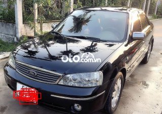 Ford Laser   MT 2004 - Cần bán gấp Ford Laser MT sản xuất 2004, màu đen