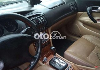 Daewoo Magnus 2004 - Bán Daewoo Magnus 2.0 năm 2004, màu đen số tự động