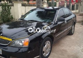 Daewoo Magnus 2004 - Bán Daewoo Magnus 2.0 năm 2004, màu đen số tự động